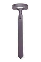 Subject shot of a classic tie made of gray silky fabric with an embroidered checkered deer head. The necktie is isolated on the white background.