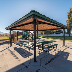 Square frame Outdoors covered tables and benches for a picnic