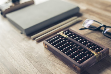 abacus and books on a table at home