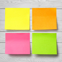 Colorful stickers on light gray wooden background