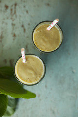Healthy green smoothie and ingredients..