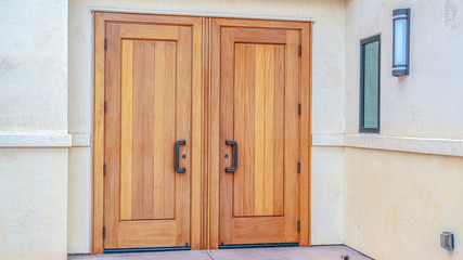 Panorama frame Closed double wooden entrance doors on cloudy day