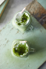Homemade iced matcha latte tea with milk..