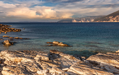 Beautiful landscape with bay. Sunny spring seascape of Ionian Sea with colorful sky during sunset....