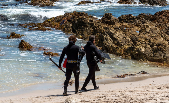 Rooiels, Western Cape, South Africa. December 2019, Two scuba divers on the beach at Rooiels for the opening of the Cray fishing season.
