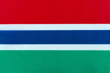 Flag of the Republic of the Gambia on a textile basis close-up