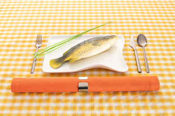 fish presentation and cutlery on plate
