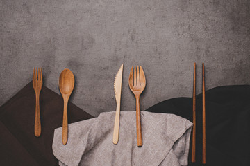 Dining accessories on the table with many clothes.