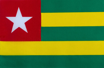 Flag of the Togolese Republic on a textile basis close-up
