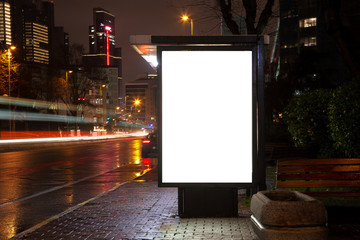 Blank billboard on night street