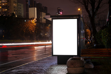 Blank billboard on night street