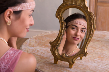 Elegant lady and antique mirror
