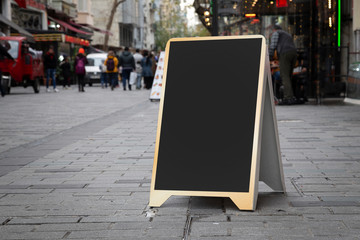 Blank billboard in front of cafe