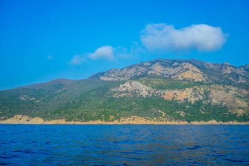 Seascape with views of the mountains near the coastline.
