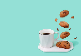 Coffee cup with soaring cookies.