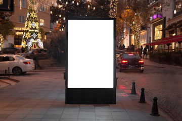 Blank billboard on night street