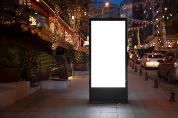 Blank billboard on night street - obrazy, fototapety, plakaty