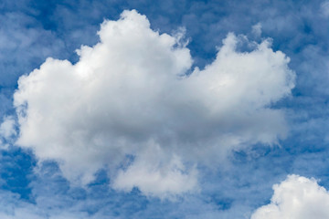 blue sky with a large white cumulus cloud as a natural background