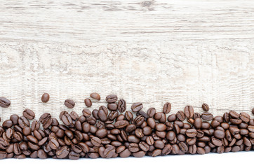 Coffee beans on wood background