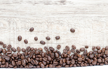 Coffee beans on wood background