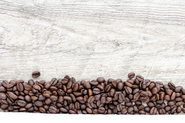 Coffee beans on wood background