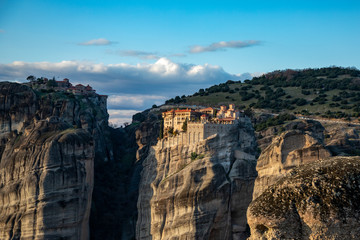 Fototapeta premium Holy Monastery of Transfiguration of Jesus (Great Meteoron) and the monastery of Varlaam. The Monasteries of Meteora at sunset an UNESCO World Heritage in Kalambaka (Kalabaka), Greece.