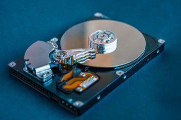 Hard disk drive platter.Disassembled hard drive from the computer with mirror effect. HDD. Detail...