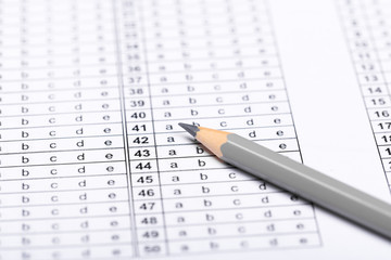 A pencil sitting on a test bubble sheet