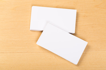 Photo of blank business cards on a general background. Template for identifier. View from above. mock up
