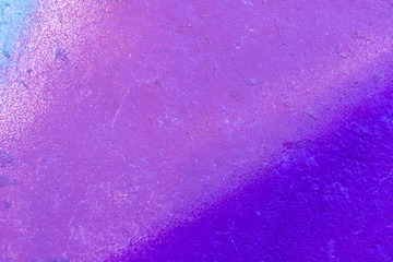 The old wall, painted in color graffiti drawing with aerosol paints. Background image on the theme of spray drawing graffiti and street art