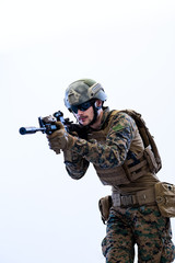 soldier in action aiming laseer sight optics