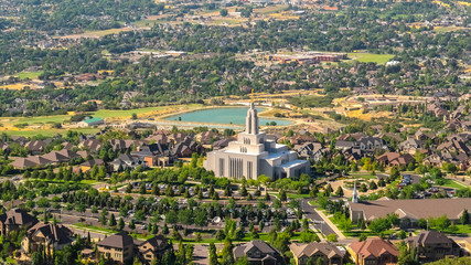 Pano frame Salt Lake City Utah views with scenic suburbs landscape against mountain and sky