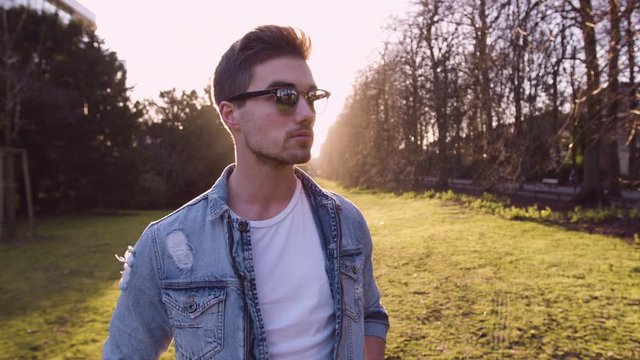 Young man enoying the sun in the park