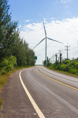 Fototapeta na wymiar Wind turbines generate electricity and blue sky