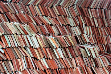 Stacks of red and brown ceramic tiles