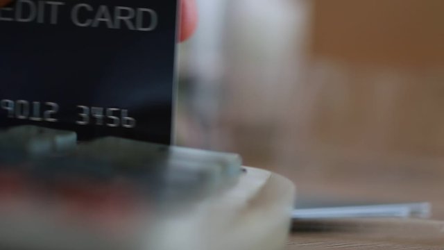 Finance Credit Card Pay concept: Payment transaction swiping cards through PIN Terminal machines for shopping, sell products service in department store.Spending for customer or ownership, mockup card