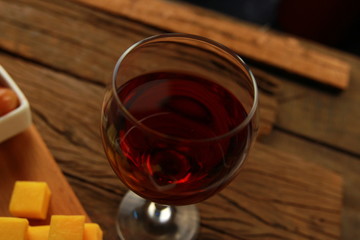 glass of red wine on wodden florr