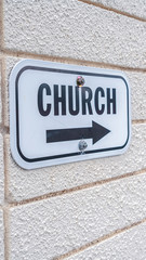 Vertical Church sign pointing to the right mounted on wall