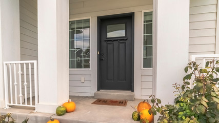 Panorama Halloween or autumn pumpkins on a house steps