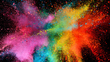 Explosion of colored powder isolated on black background