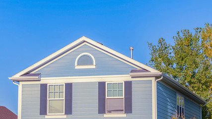 Panorama frame Attractive blue timber house with white detail
