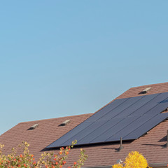 Square Photovoltaic solar panels on a house roof