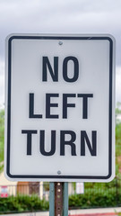 Vertical No Left Turn traffic sign on a pole