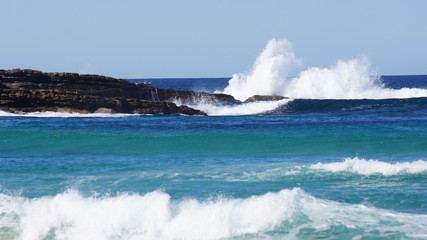 Waves hitting rock Australia