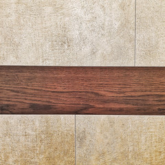 Ceramic tiles with wooden border for wall and floor decoration. Concrete stone surface background. Texture for interior design project.