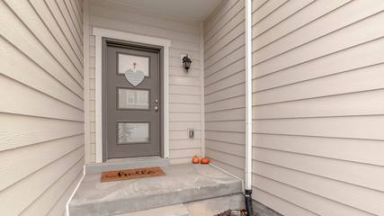 Panorama Small white entrance walkway and front door