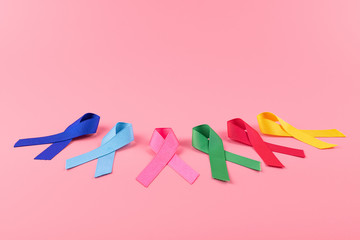 World cancer day (February 4). colorful awareness ribbons; blue, red, green, pink and yellow color...