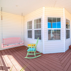 Square frame Wooden deck with rocking chair on a house