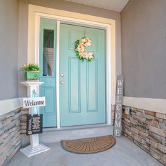 Square frame Green painted front door to a suburban house