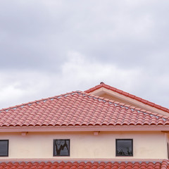 Square Tiled roof on a building with ventilation windows